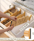 Hella Sturdy Bamboo Drawer Dividers Expandable Closet Organizers For Clothes in a drawer with non-slip pads, adjustable from 17.72 to 22.84 inches.
