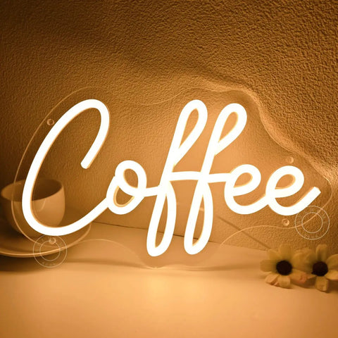 Coffee Neon Light Sign USB Powered Wall Or Table Decor For Home Kitchen Cafe Bar Warm White 11.8 Inch By 6.69 Inch Night Light Mood Builder With Pre Drilled Holes And 6.6 Ft USB Cord displaying in warm white glow on a tabletop