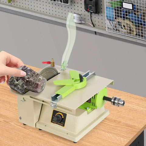 Beast 1380W Mini Table Saw and Jewelry Polisher adjusts speed on wood bench with hand holding jade stone for cutting.