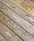 Hella Tough Water Repellent Spray For Concrete Brick Stone Stucco Wood Deck Fence Ready To Use on a wet wooden deck after application.