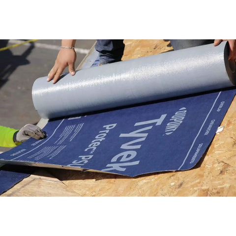 Peel And Stick Roofing Underlayment Ice Dam Blocker Tough As Nails Waterproof Deck Shield Slip Resistant Walking Surface For Asphalt Shingles 3 By 67 Feet Single Roll being unrolled on a roof surface.