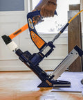 3-In-1 Pneumatic Flooring Nailer And Stapler, 15.5-Gauge Staples And 16-Gauge Cleats, 2-Inch Capacity in use on hardwood floor