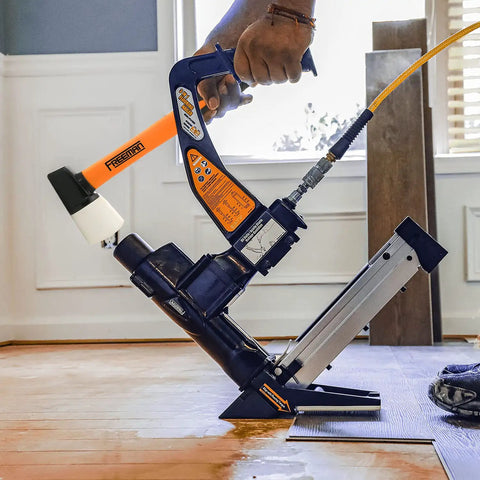 3-In-1 Pneumatic Flooring Nailer And Stapler, 15.5-Gauge Staples And 16-Gauge Cleats, 2-Inch Capacity in use on hardwood floor