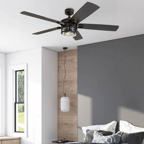 Bonterra 52 Inch Ceiling Fan With LED Light And Remote in modern matte black finish in large bedroom setting.