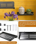 Super Sleek Aluminum RV Folding Wall Shelf With Hidden Drop Down Design Wall Mounted with flowers and decorative items displayed.