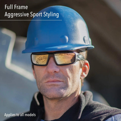 Worker wearing blue hard hat and clear frame safety glasses with anti fog coating and anti scratch lenses for all day comfort.