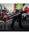 Person carrying 2136-20 Cordless Tripod Light For 18V M18 Rocket System, showcasing quick setup and easy transport features.