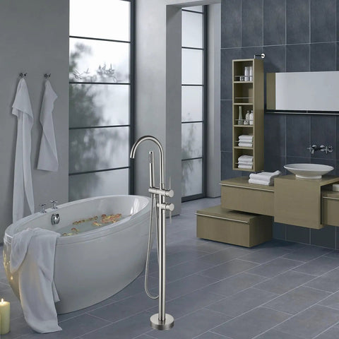Sleek Floor Mounted Freestanding Tub Filler Faucet with Handheld Shower in Brushed Nickel Finish in modern bathroom.