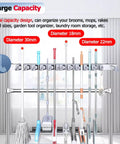 Heavy Duty Stainless Steel Cleaning Supplies Organizer Rack With No Slip Mop Holder Waterproof Wall Mount Storage System shown holding various cleaning tools.