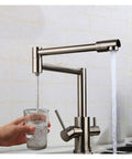 GAZOGJ Faucet, Brass Brushed Kitchen Folding Faucet with Pure Water Cold Hot Kitchen Modern Drinking Water 3 Way Filtered Faucet Mixer,Brushed with Hose-D dispensing clear water into a glass.