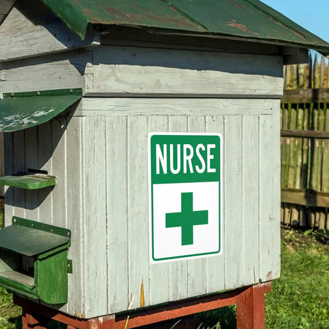 First Aid Station Nurse Symbol Safety Warning Sign 8x12 Aluminum Plaque on wooden outdoor structure with green roof
