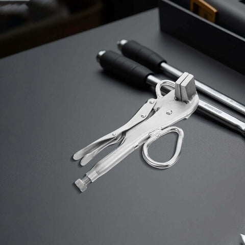 Adjustable Auto Body Frame Pulling Clamp With Extra Wide Duckbill Jaw on a workbench next to tools