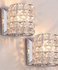 Crystal Wall Sconce Set of Two Modern Chrome Finish Wall Lamps with Crystal Accents for a Slick Vibe 1 Light for Living Room Bedroom Powder Room TV Wall Decor, shining on a wall.