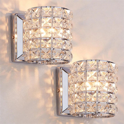 Crystal Wall Sconce Set of Two Modern Chrome Finish Wall Lamps with Crystal Accents for a Slick Vibe 1 Light for Living Room Bedroom Powder Room TV Wall Decor, shining on a wall.