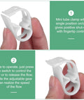 Close-up of a hand holding a mini white plastic tube clamp for 1/4 to 1/2 inch flow control, part of the 10-Pack Adjustable Plastic Tubing Clamps.