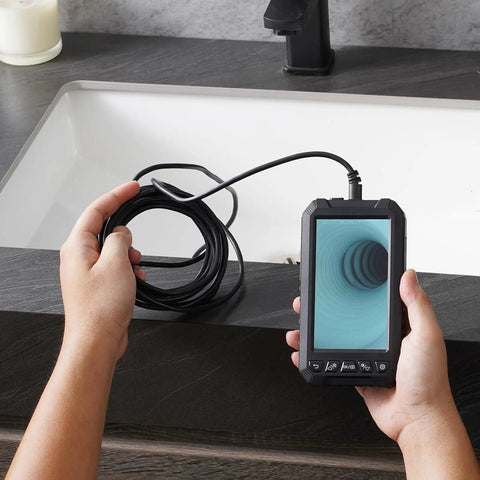 Pro Grade Endoscope Camera With Light Featuring Triple Lens For Clear Real World Inspection, 5 Inch Screen 1080P, 8 Plus 2 LED Lights With Adjustable Brightness, IP67 Waterproof Snake Camera For Automotive And Plumbing, 16.4 Foot Cable And 32GB Card. handheld endoscope showing coiled cable and 5-inch screen