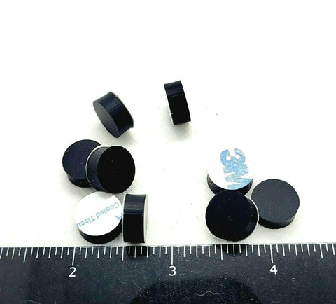 One Half Inch Round Silicone Rubber Bumper Feet Three Sixteenths Of An Inch Thick Adhesive Backed Spacer Pads scattered on surface