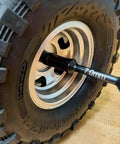 Close-up of Gen 2 Amber Handles Hex Driver Set Three Pack For Precision RC Tools and Electronics, removing 7.0mm hex nut on wheel.