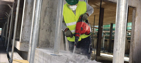 Worker using Beast 120 Volt SDS Max Corded Rotary Hammer Drill Kit With AVR Vibration Reduction Includes TE 70 Rotary Hammer in construction site
