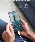 Man using Premium Usb C To 3.5Mm Audio Adapter With Smart Dac Chip on smartphone, playing music with wired headphones.