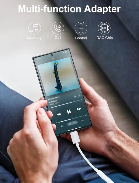 Man using Premium Usb C To 3.5Mm Audio Adapter With Smart Dac Chip on smartphone, playing music with wired headphones.