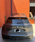 Rear view of BMW iX with Roof Rack Cross Bars For iX 2020 And Up No Drilling Aluminum T Slot Design Lockable 330 Lbs Load