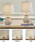 21 Inch 3 Way Dimmable Touch Table Lamp With Two Usb Ports, set of 2, antique floral design, linen shade, showing dimming levels.
