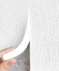 Thick Peel And Stick Foam Wall Panels With Heavy Duty Thermal Insulation being applied to textured wall.