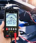 Hand using Smart Auto Ranging Digital Multimeter TRMS 6000 Counts Handy Electrical Tester in car engine diagnostics.