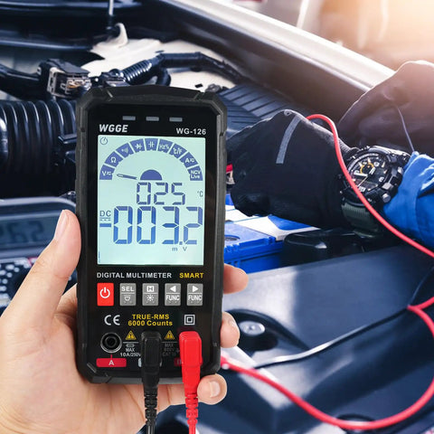 Hand using Smart Auto Ranging Digital Multimeter TRMS 6000 Counts Handy Electrical Tester in car engine diagnostics.