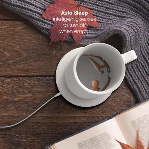 Smart Self Heating Coffee Mug With Gravity Sensor Coaster And Lid Holds Ideal Heat For Office Or Home Use Solid Stainless Steel Build on wooden table.