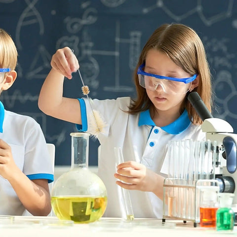 Children using 4 Piece Lab Flask Brush Set for 250ml Volumetric Flasks, Glass Tubes and Beakers in a science class setting.