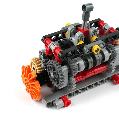 Close-up of Dope High Tech Manual Gearbox Building Kit with gears and axles for 4, 5, and 6-speed options STEM puzzle toy for adults