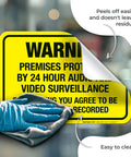 Keep Drifters From Meddling With Your Patch With This Legit Heavy Duty Security Surveillance Decal Sticker Warning Folks Cameras Rolling 24 Hour, yellow vinyl decal being cleaned.