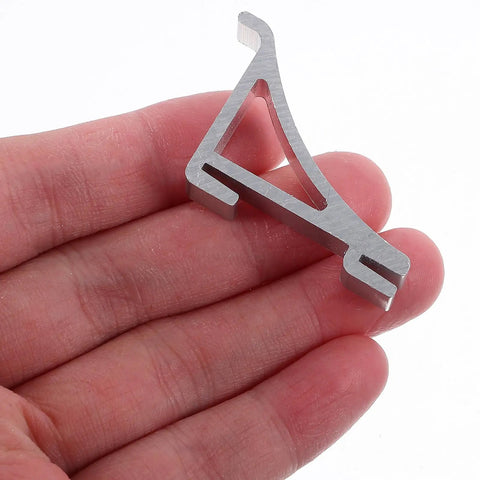 Close-up of a 10 Pack Aluminum Freezer Shelf Clips, Sturdy Refrigerator Shelf Hooks with smooth edges, held in hand for size reference.