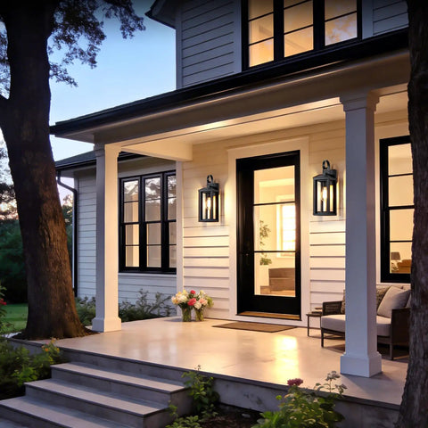 Top Shelves Two Pack Of 17 Inch Exterior Wall Sconces For House Facades showing matte black lights beside a modern porch entrance.