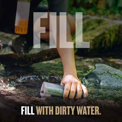 Person collecting water from stream with UltraPress Replacement Purifier Cartridge for Portable Water Purifier Bottle Orange.