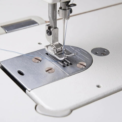 Fresh 20 Pack Tp Type Sewing Machine Needle Plate Screws With Standard Thread Replacement Fasteners For Brother Juki Singer Consew Industrial And Household Single Needle Equipment Repair Upkeep And Bulk Maintenance Projects, close-up of a sewing machine needle and plate.