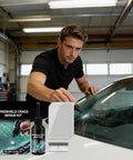Windshield Crack Repair Kit Do It Yourself Glass Repair Solution Quick Fix For Home Roadside And Auto Shop Use Three Step Process To Restore Chips And Cracks With Invisible Finish And Durable Seal with man applying repair solution on car windshield in garage.