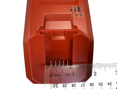 Close-up of C 4/12 50 Battery Charger for Cordless Systems 110V Black with ruler showing connector size