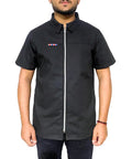Slick Half Sleeve Barber Jacket Zip Front Men Salon Smock Lightweight Black Hairdresser Uniform worn by male model, zip front design.