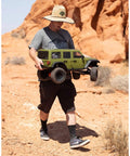 Person holding One Sixth Scale SCX6 Jeep Wrangler 4x4 Rock Crawler RTR With Two Speed Transmission and Beefed Up Front and Rear Suspension