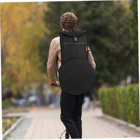 Man using Heavy Duty Waterproof Dumb Drum Storage Bag Premium Oxford Percussion Hauler while riding a scooter.