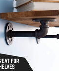 Shelf mounted with one half inch by one inch black pipe nipple ten pack malleable cast iron close nipples for dope industrial decor.