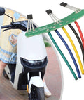 Badass 41F Hall Effect Sensor Board For 1000W To 2000W Brushless Motors On Electric Trikes, shown with colored wires on an e-scooter.