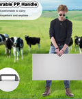 Person holding Heavy Duty Workhorse Electronic Platform Scale Built Tough For Livestock Shipping Large Breed Dog Weighing Multi Purpose commercial grade scale in green field.