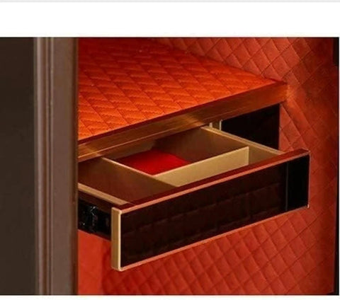 Open drawer of a compact home safe box for personal valuables made from steel with shock proof construction