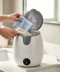 Level Up Your Laundry Routine With This Lowkey Essential 13L Mini Underwear Washing Machine For Socks And Baby Garments Hygienic Desk Sanitary Spin Dryer Safe Gentle Touch Zero Hassle with hands placing delicates inside.