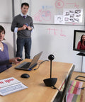 All In One Desktop Video Conference Webcam With Carl Zeiss 1080p Hd Lens And Full Duplex Speakerphone in a meeting room setup.