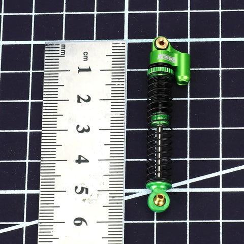 Beefed Up Aluminum Oil Filled RC Shocks for Axial AX24 XC1 4WS 1 24 Scale Upgrades with ruler for size reference